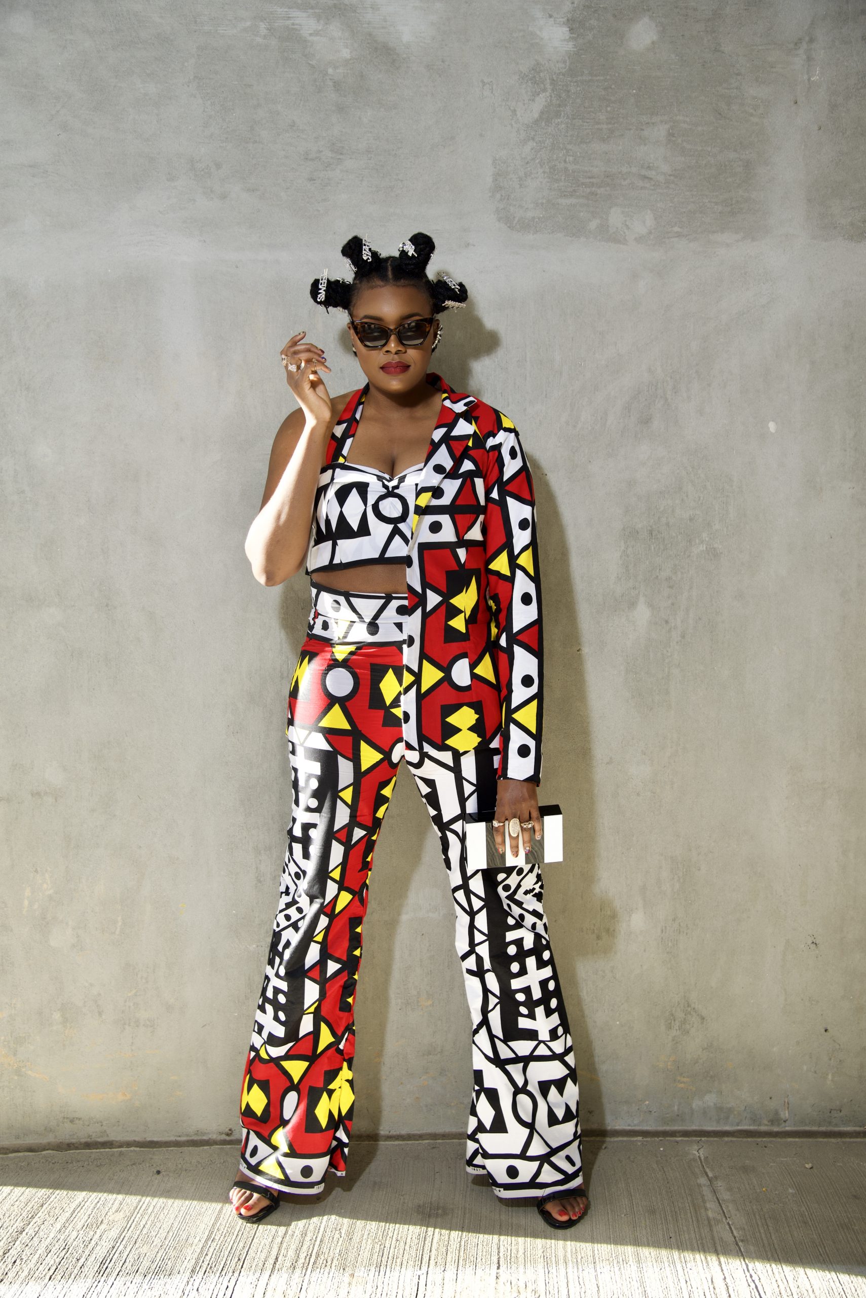 https://www.nikkithejeanius.com/shop/wp-content/uploads/2020/11/Samakaka-Samacaca-Angola-Red-Yellow-Black-White-Half-Croptop-Half-Blazer-Wide-Leg-Pants-Ankara-African-Print-Suit-1-scaled.jpg